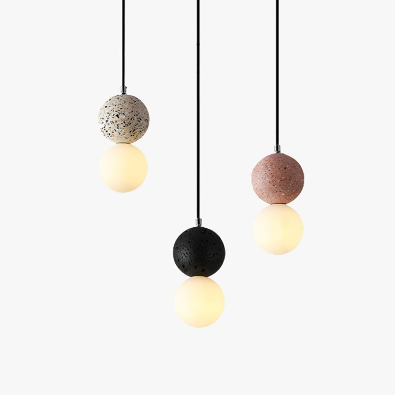 Modern dining room lighting with a globe pendant light above a dining table